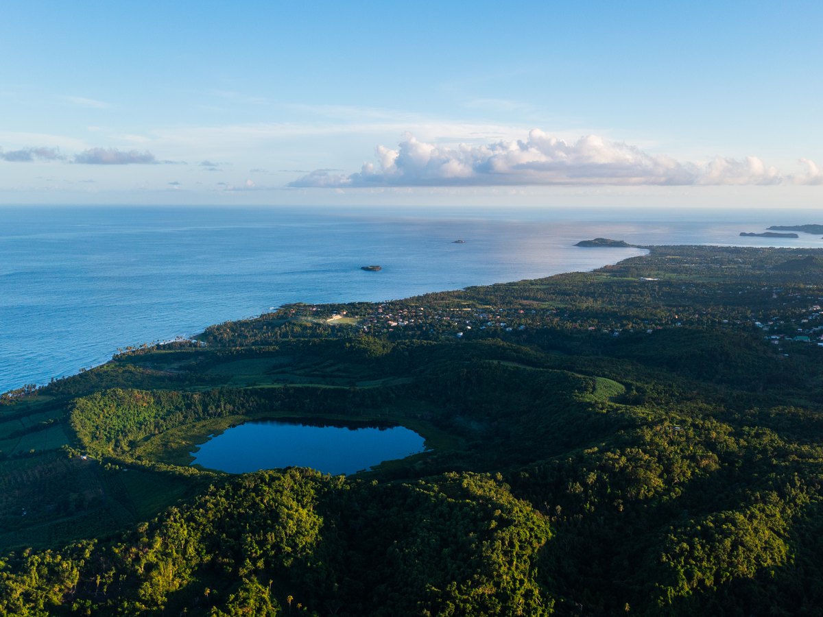 A crater lake and the north coast of Grenada from the air