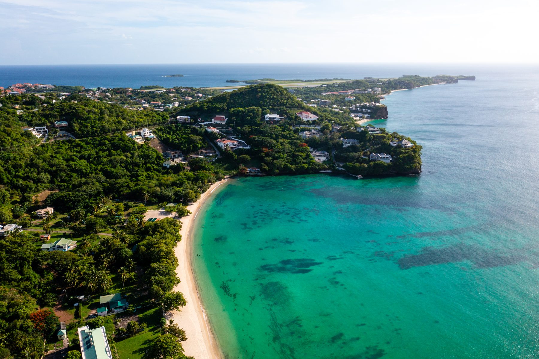 Aerial view of a Grenada beach, turquoise water and the coast toward Point Salines