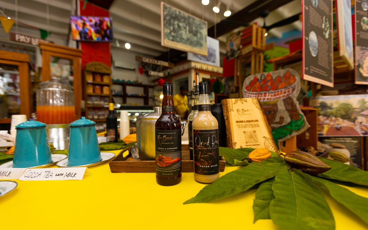 Cocoa rum liqueurs and fresh cocoa pods at the tasting