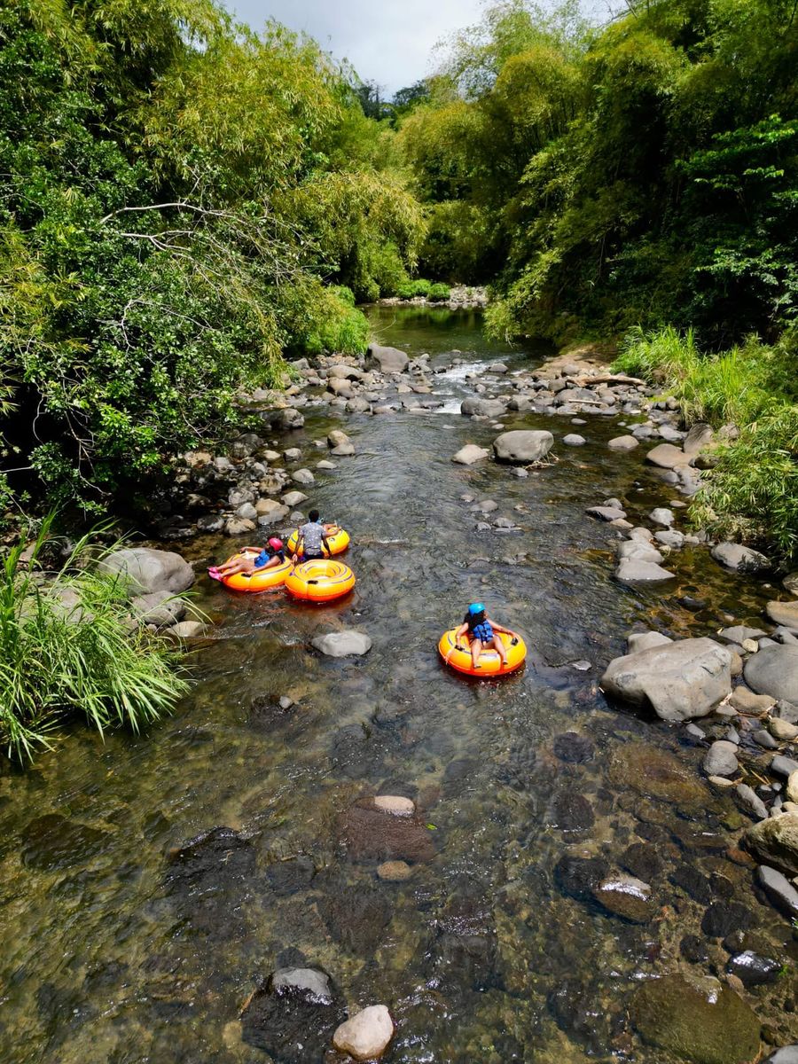 A tubing group working down the river