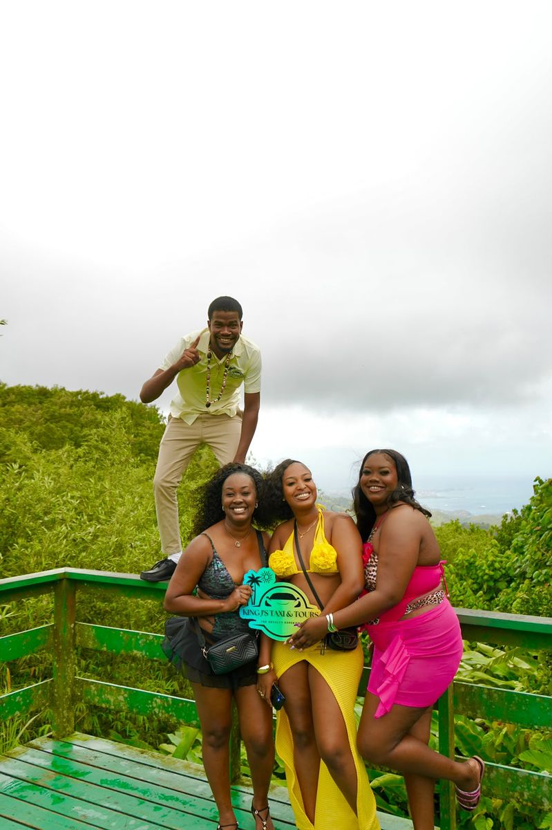Guests and their driver at a hilltop lookout