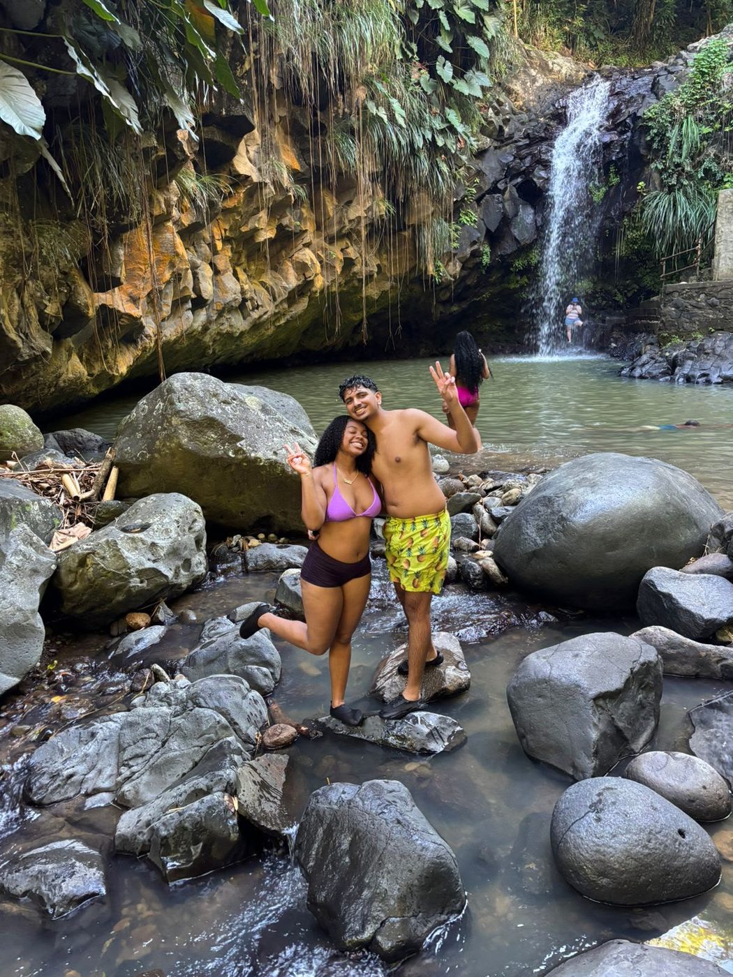 Guests at the waterfall pool on the King J’s rainforest tour