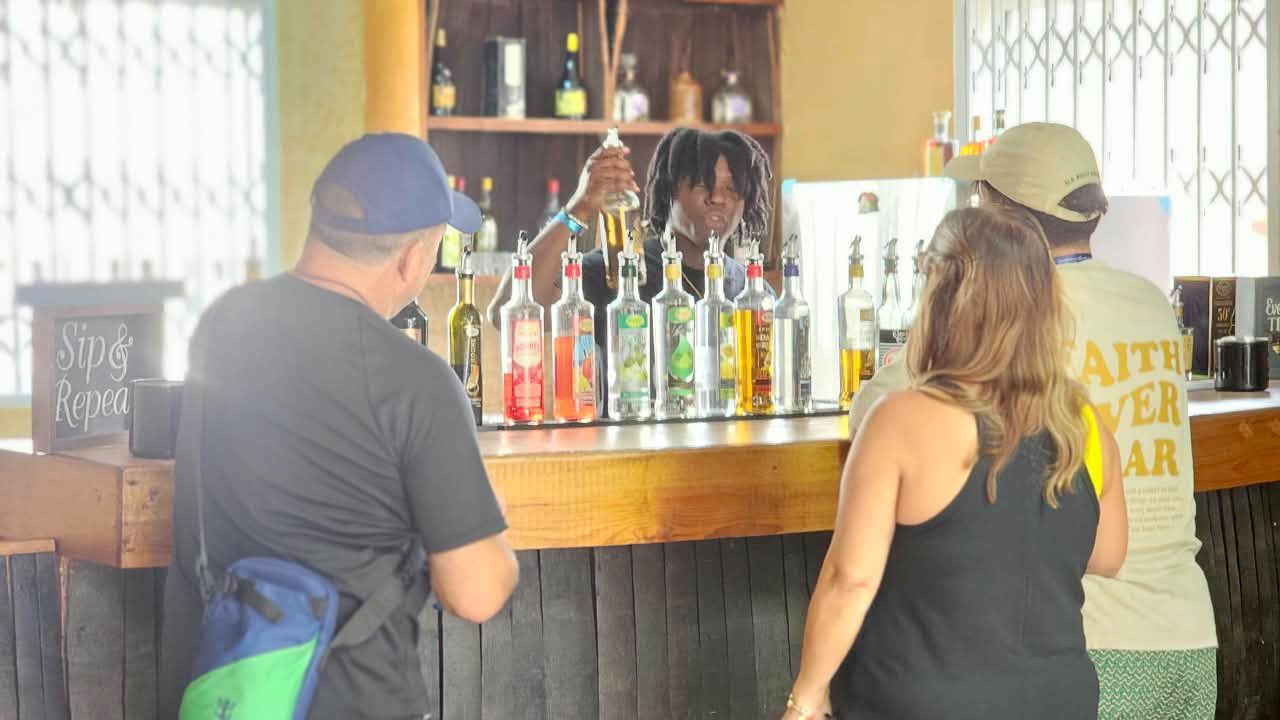 Pouring the rum tasting at the distillery bar